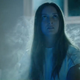 Billie Lourd's American Horror Stories character looks witchy with long hair and smoke rising off of her body.